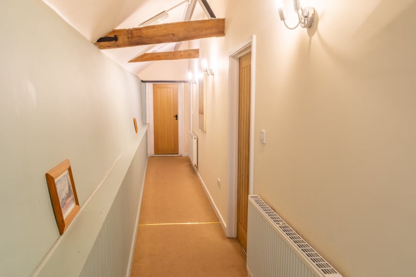 Access to bedrooms and steam room at end of hall